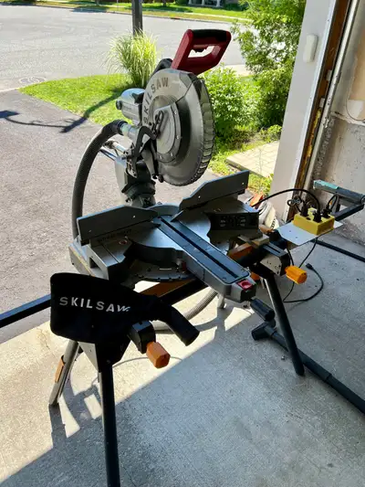 Skil worm drive 12 inch miter saw dual bevel sliding. Comes with stand, vacuum cleaner hook up throu...