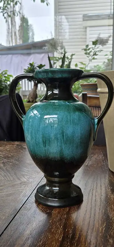 This knockout Blue Mountain Pottery 12 inch urn style vase features a glazed teal blue green and bla...