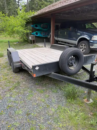 12’ Double A Low Deck trailer with 10,000lbs Very lightly used over the last 3 years for hauling fee...
