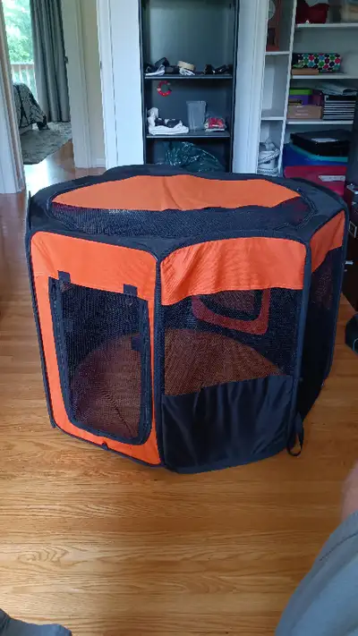 six sided with top and bottom, pet playpen 24" high, 34" diameter folds up into handy carrying case...