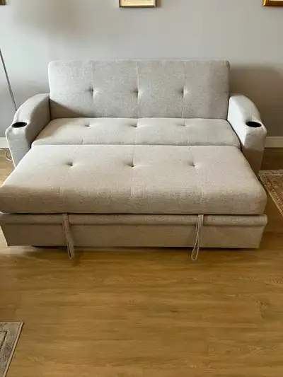 Sofa which opens out into a doble bed., View more