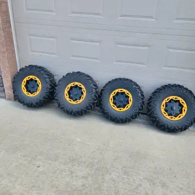 Stock tires and bead lock rims (4x137mm) from a 2012 Commander. 5,088 km on them. Some tires have pa...