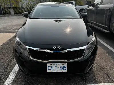2012 Kia Optima EX, a sleek and reliable sedan. This used car offers a smooth driving experience and...
