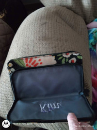 Wallet ingraved with the name Kim. Thirty one.