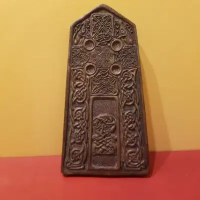 This Celtic cross tablet , Art- is a bronze coloured piece. The back of the tablet provides a descri...