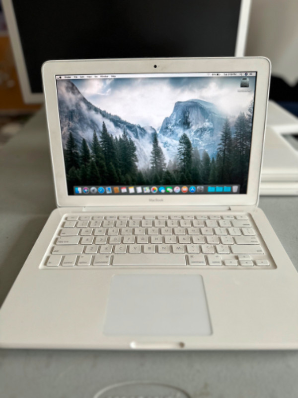 White Macbook with Glowing Apple Logo in Laptops in St. Catharines