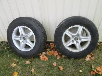 PAIR OF 16in LEXUS RIMS (1 NEW) with 1 NEW 225/70R16 bridgestone dueler H/T tire $125.00 PHONE ONLY...