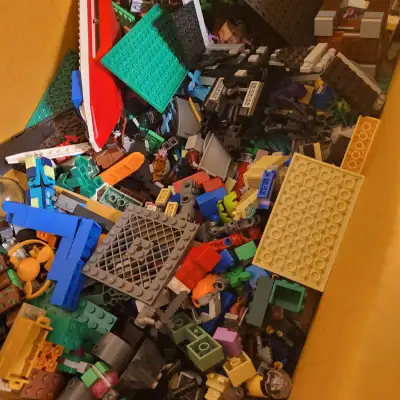 Box of Legos and minifigures, View more