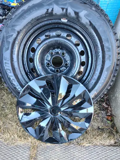 4 Bridgestone Winter Tires with Rims & Hubcaps + 20 Bolts Excellent condition!! Used for one season...