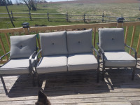 Patio couch and two chair set.