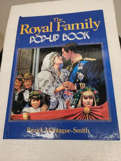 The Royal Family Pop-Up Book - Hardcover This is a unique Pop-Up book titled "The Royal Family" auth...