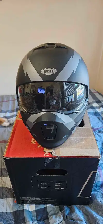 This is a Bell motorcycle helmet, perfect for ensuring safety and style on the road. Being never use...