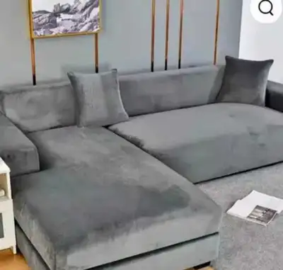 Sink into the plush comfort of this used grey sectional sofa, perfect for lounging and relaxation in...