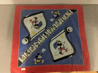 A vintage bandana featuring Mickey Mouse and Minnie Mouse.