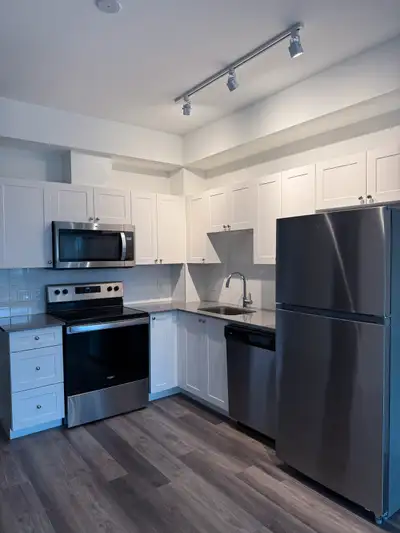 Spacious 1+Den Condo with Balcony, Parking & Amenities