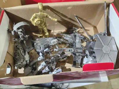 Dive into a galaxy far, far away with this collection of Star Wars Metal Earth models, perfect for f...