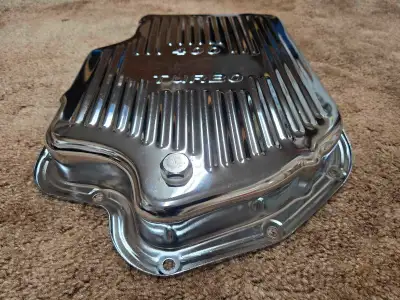 I have a brand new chrome Chevrolet Turbo 400 oil pan with drain plug and gasket for sale. No scratc...