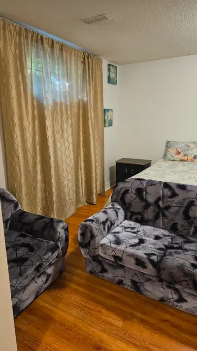 A bright and spacious basement apartment is fully furnished with its own kitchen, washroom and showe...