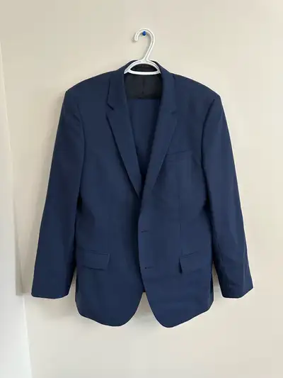 Authentic Hugo Boss men’s 2 piece blue suit with jacket and pants. The jacket is size 42. The pants...
