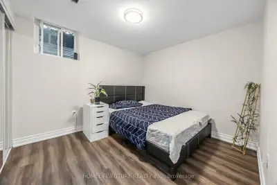 The updated basement features a separate entrance, its own kitchen, 3 additional bedrooms, and 2 ful...