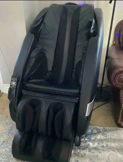 Indulge in relaxation with this used black massage chair, designed to provide full-body comfort and...