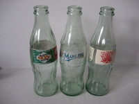 3 commemorative Coke bottles