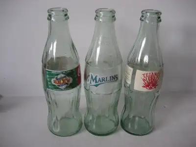3 commemorative Coke bottles, View more