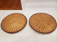 2 large round flat brown baskets