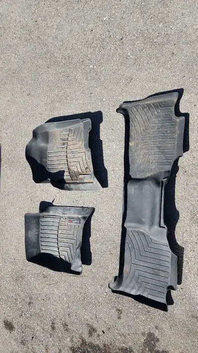 I'm selling a set of used WeatherTech floor mats specifically designed for a 2008 Cadillac Escalade....