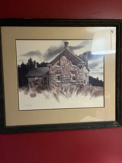 This Jack Reid print captures a beautiful stone house in a serene, rural setting. The piece is frame...