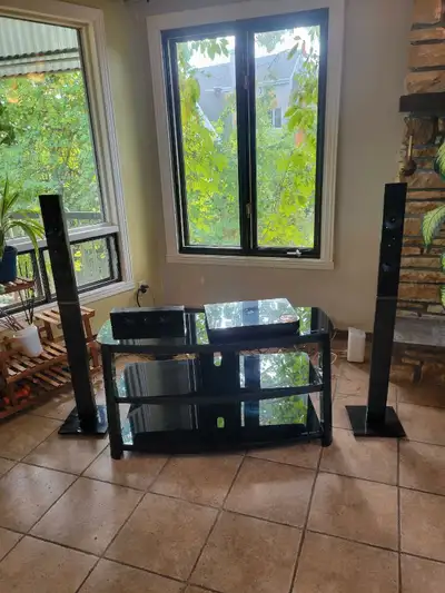 Set of 3 speakers: 2 tall standing speakers + 1 horizontal center speaker. Sleek black design, good...