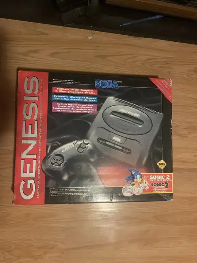 Have a sega genisis with original box, sonic 2, batman, columns, and arcade classics. Has 2 controll...