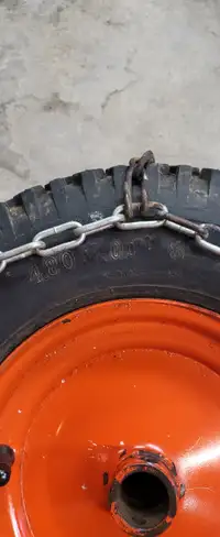 Snow blower wheels with chains