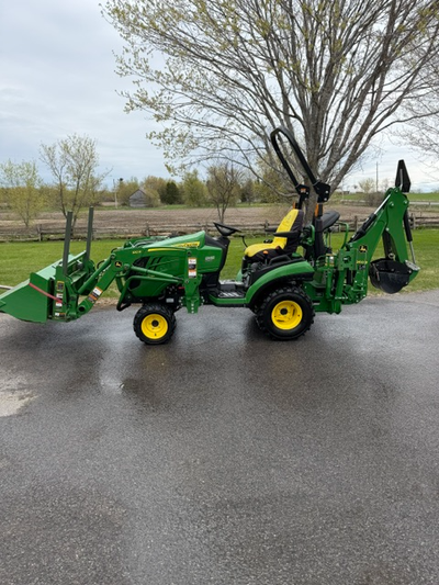 2021 John Deere tractor loader backhoe. Comes with set of pallet forks, mechanical backhoe thumb and...