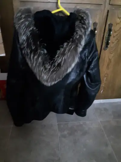 I'm selling a sweet leather winter jacket. Fur trimmed hood. Size small. This jacket was over $200.0...