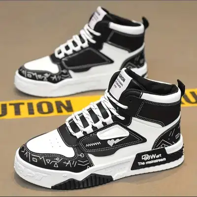 Pair of black and white high-top sneakers. Unique design features. Lightweight and comfortable. UNIS...