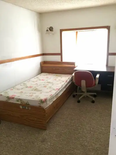 A well-maintained furnished bedroom is available on the main floor of a house. The room features fre...
