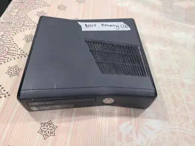 Xbox 360 Slim. console not turning On. for parts., View more