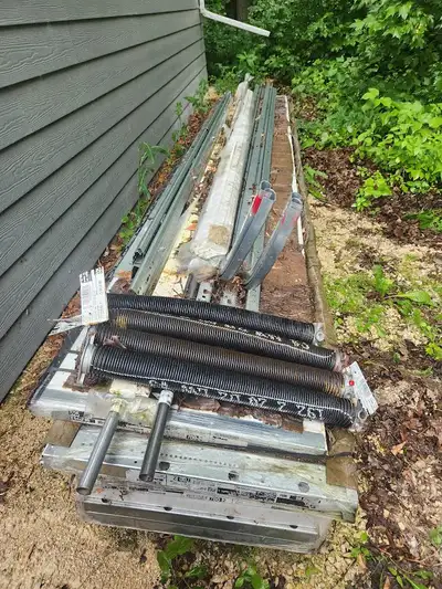 Two new uninsulated overhead steel garage or shed doors, 9 ft high, 11 ft wide. Doors were purchased...
