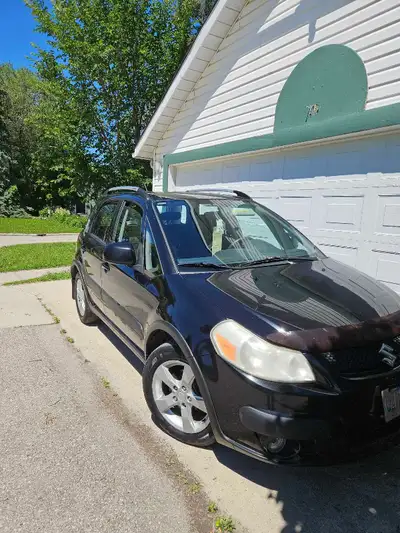 Suzuki SX4 AWD black hatchback. It was used as a daily city runner. Selling as bought new vehicle. C...