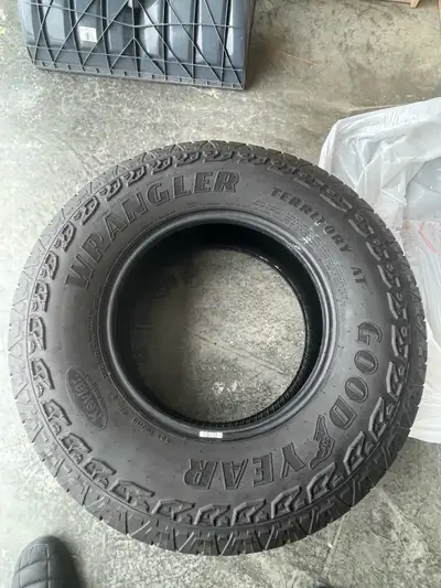 Goodyear Wrangler Territory A/T tires with Kevlar, taken off a 2023 Toyota Tacoma. Perfect for Light...
