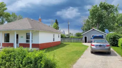 Cute two bedroom house. Huge yard. Single garage included