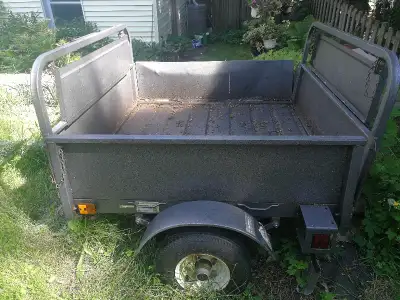 4 X 4 licensed utility trailer in very good condition. Galvanized metal sides and floor. Front gate...