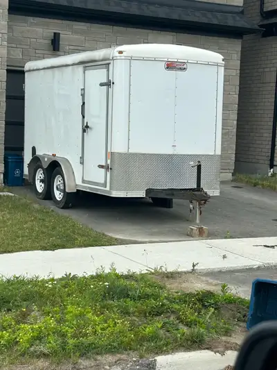14 foot cargo trailer with lights on the inside and recessed wheels which makes it more convenient f...
