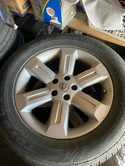 18 INCH NISSAN FACTORY ALLOY RIMS with center caps. Comes with Toyo 235/65 R18 Tires. Bolt pattern 5...