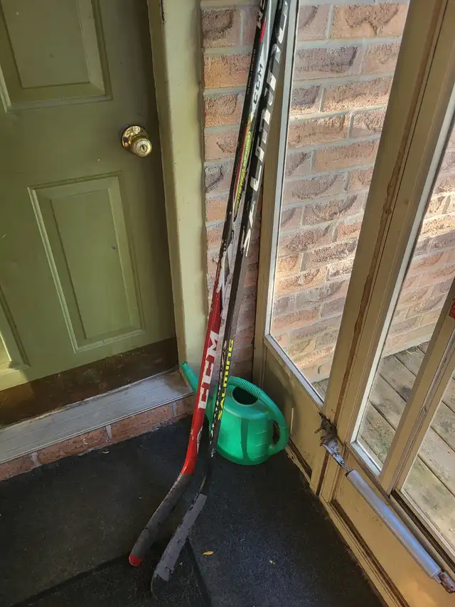 2 right handed hockey sticks