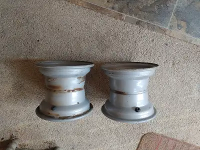 Pair of rims from a lawn tractor. 3/4 inch center hole, 8 inch diameter, 7 inches wide. Very good co...