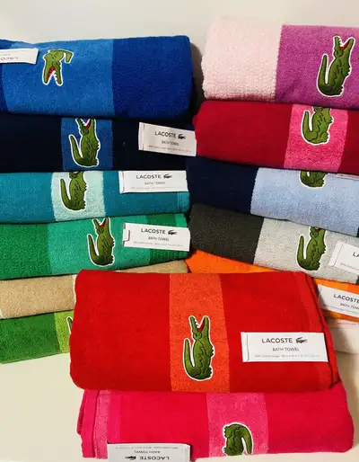Lacoste towels each $35 firm, View more