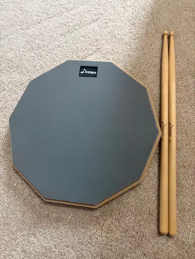Donner practice pad with Donner drumsticks, dm for details