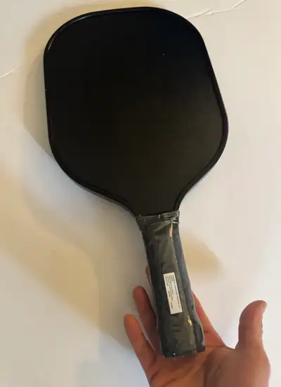 I'm selling a brand new black pickleball paddle, ready for your next game! This paddle has never bee...